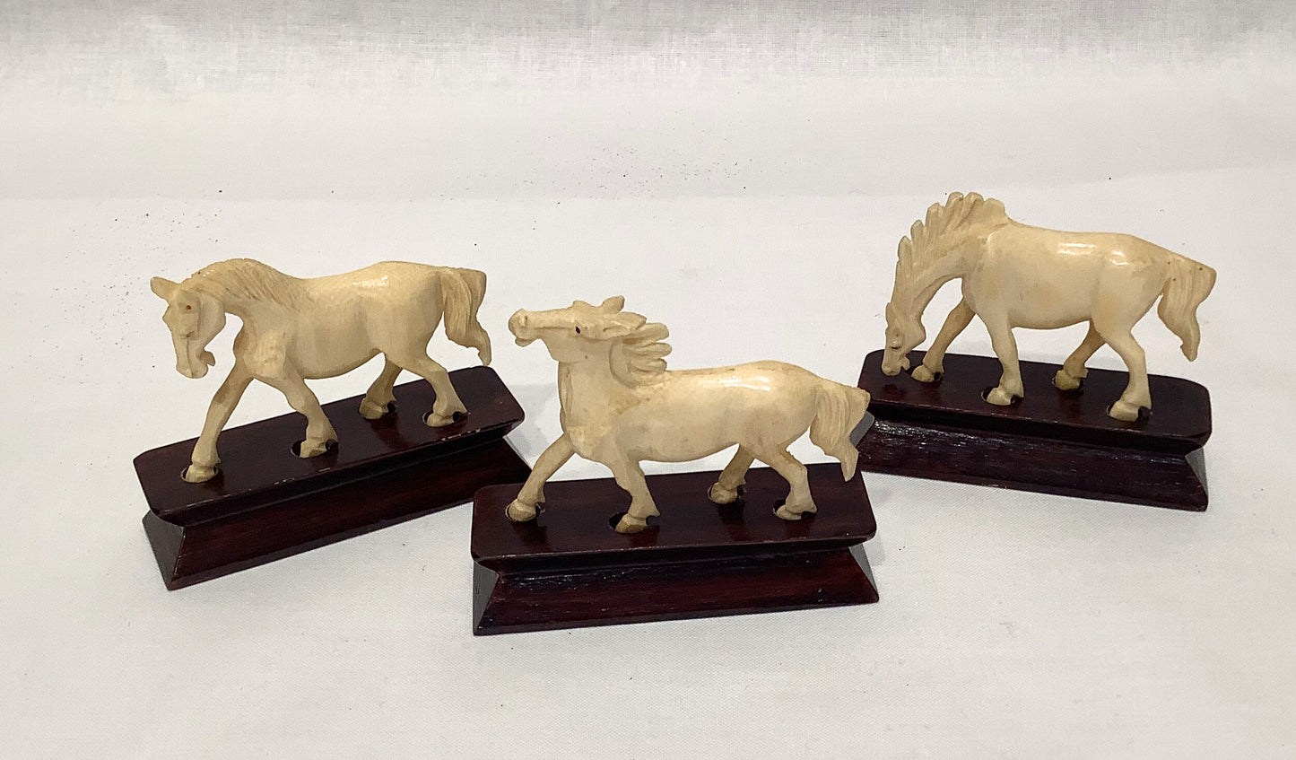 Ivory Horses on Wood Stands