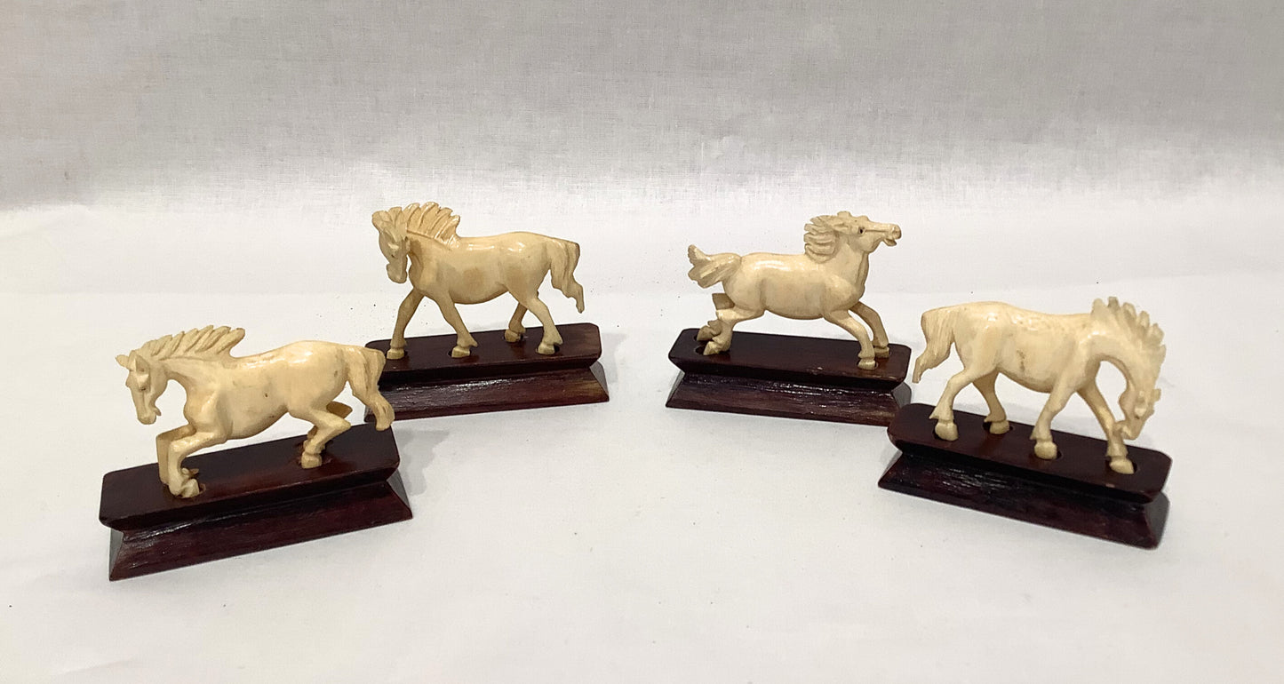 Ivory Horses on Wood Stands
