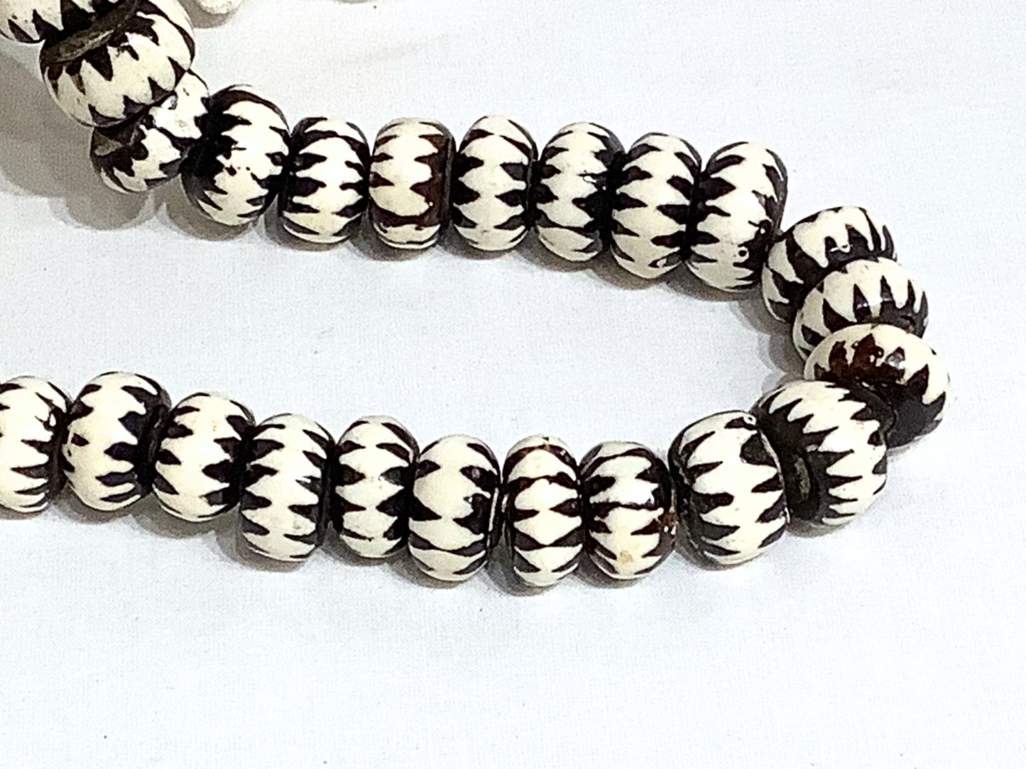 Strand of carved beads