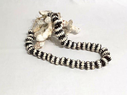Strand of carved beads